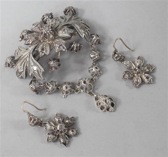 A silver and rose cut diamond set drop brooch and a pair of similar earrings.